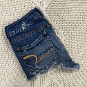 AMERICAN EAGLE DISTRESSED SHORTIE SHORTS